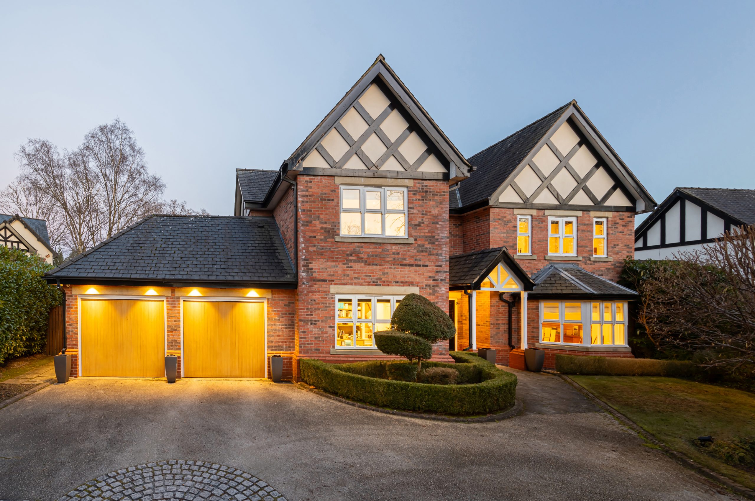 Brick-built Tudor-style detached house with double garage and bay windows